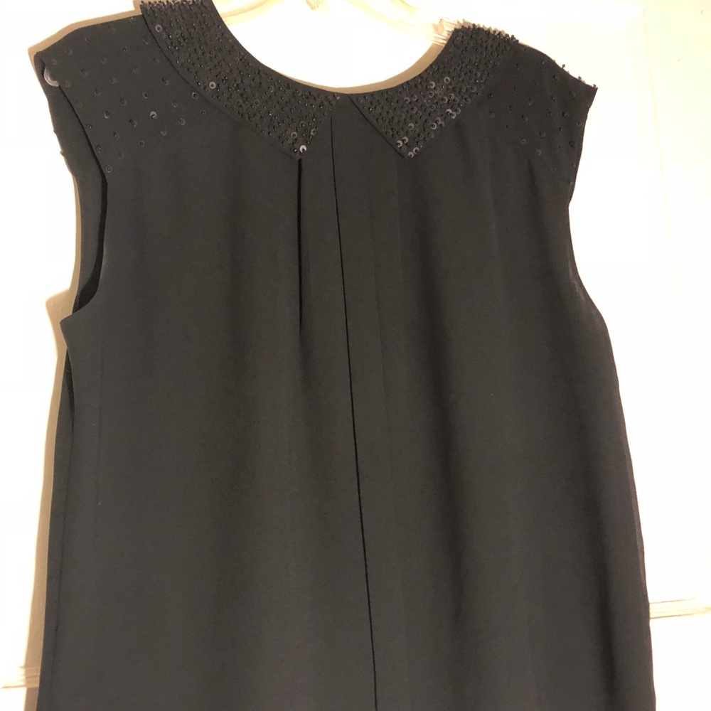 Sleeveless black blouse